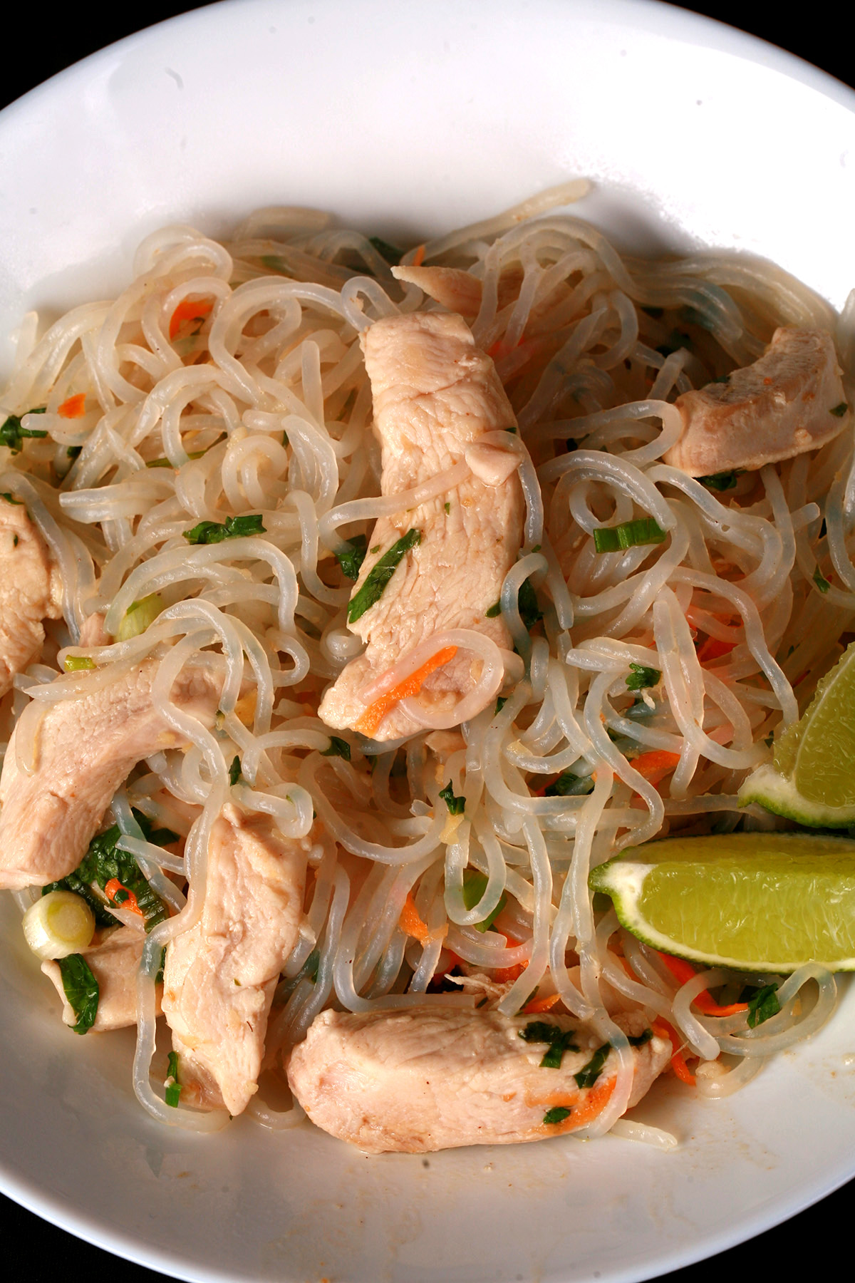 A plate of paleo chicken pad thai, made with shirataki noodles.