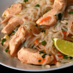 A plate of paleo chicken pad thai, made with shirataki noodles.