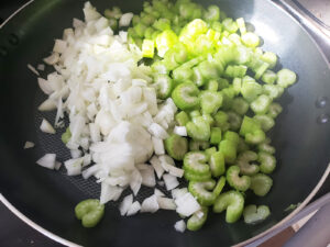 Chopped celery and onions in a nonstick pan.