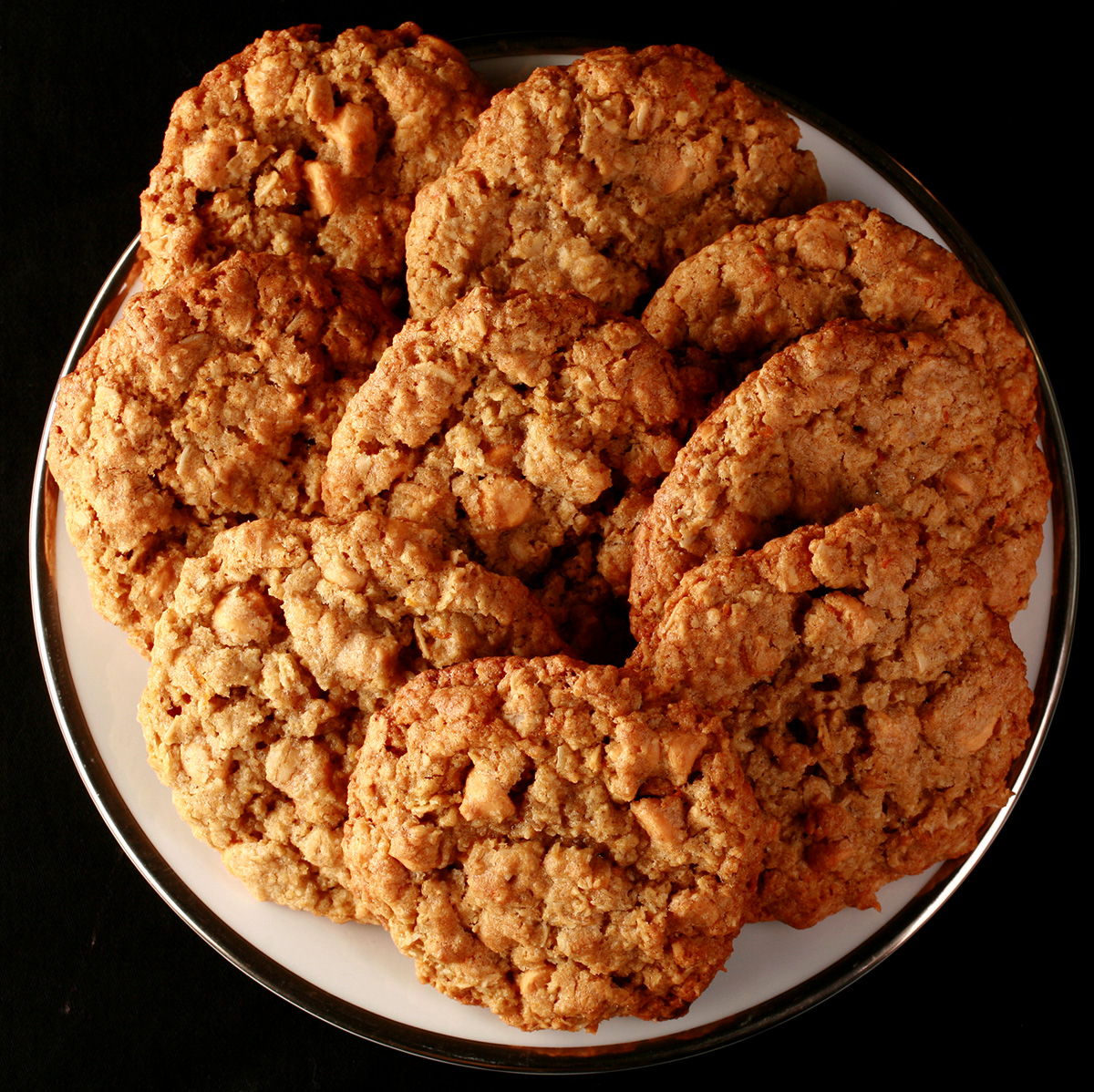 Close up photo of a plate of oatmeal cookies with visible butterscotch chips