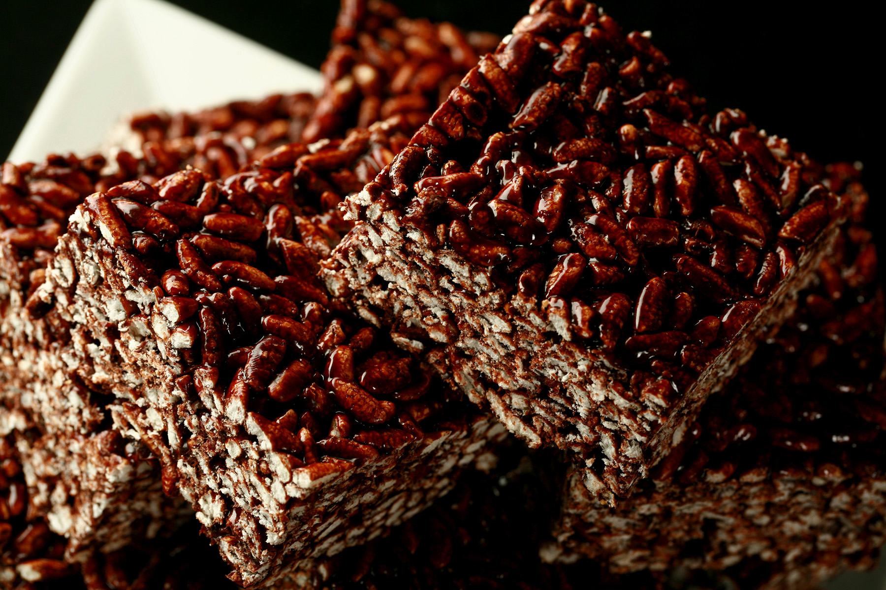 A close up view of large squares of puffed rice bars.