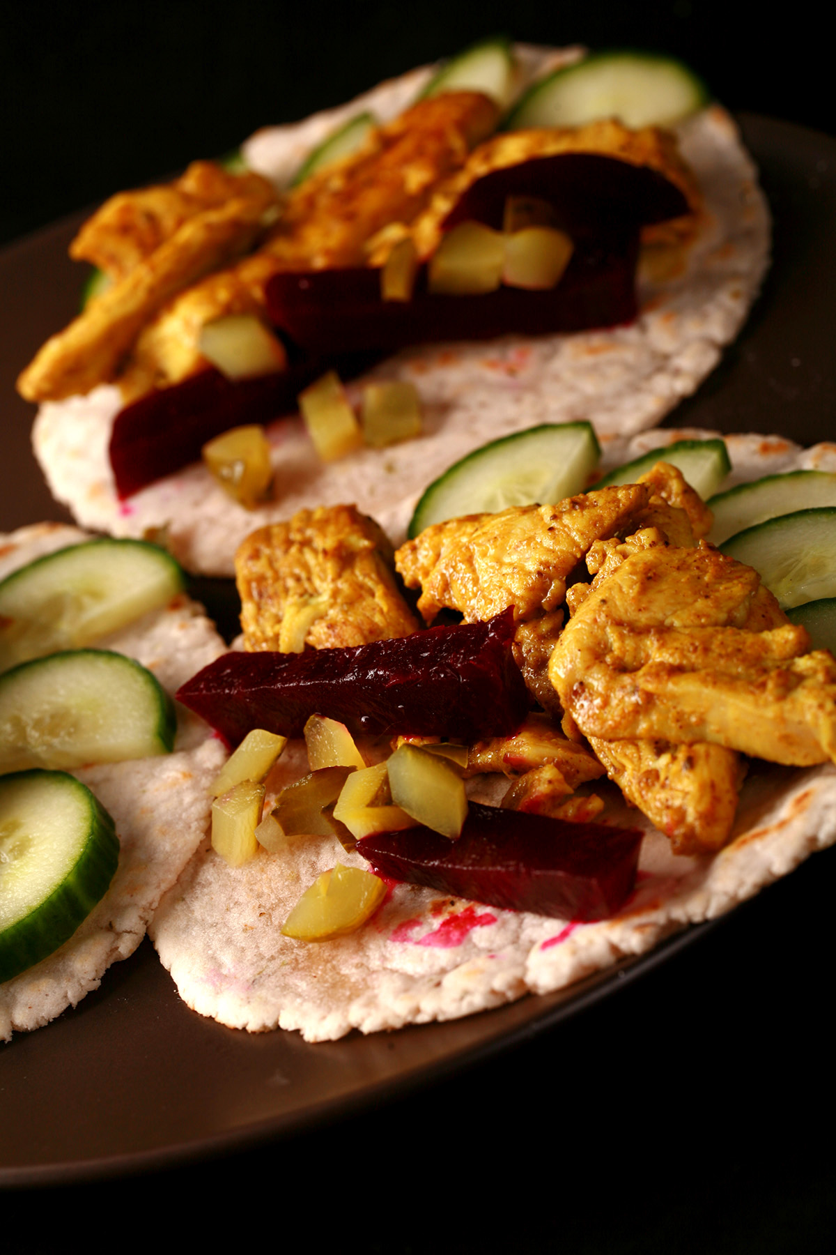 3 cassava tortillas topped with Paleo chicken shawarma, pickled beets, and cucumber slices.