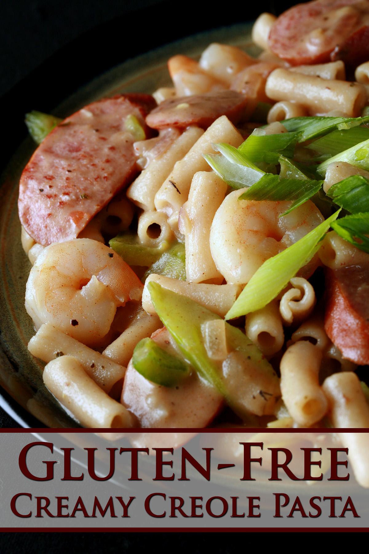 A plate of gluten-Free Creamy Creole Pasta.  Shrimp, chicken, sausage, and celery are visible.