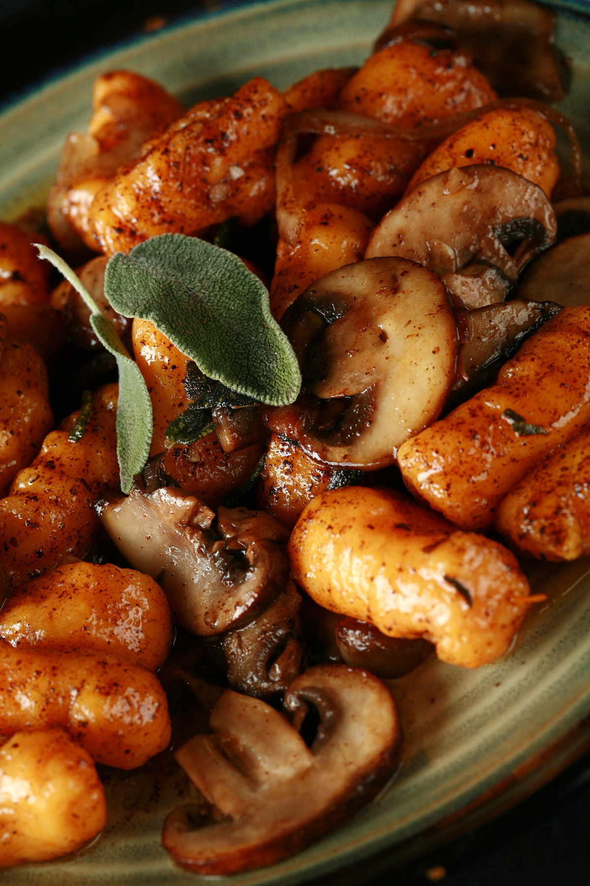 Close up view of paleo sweet potato gnocchi with mushrooms and sage.