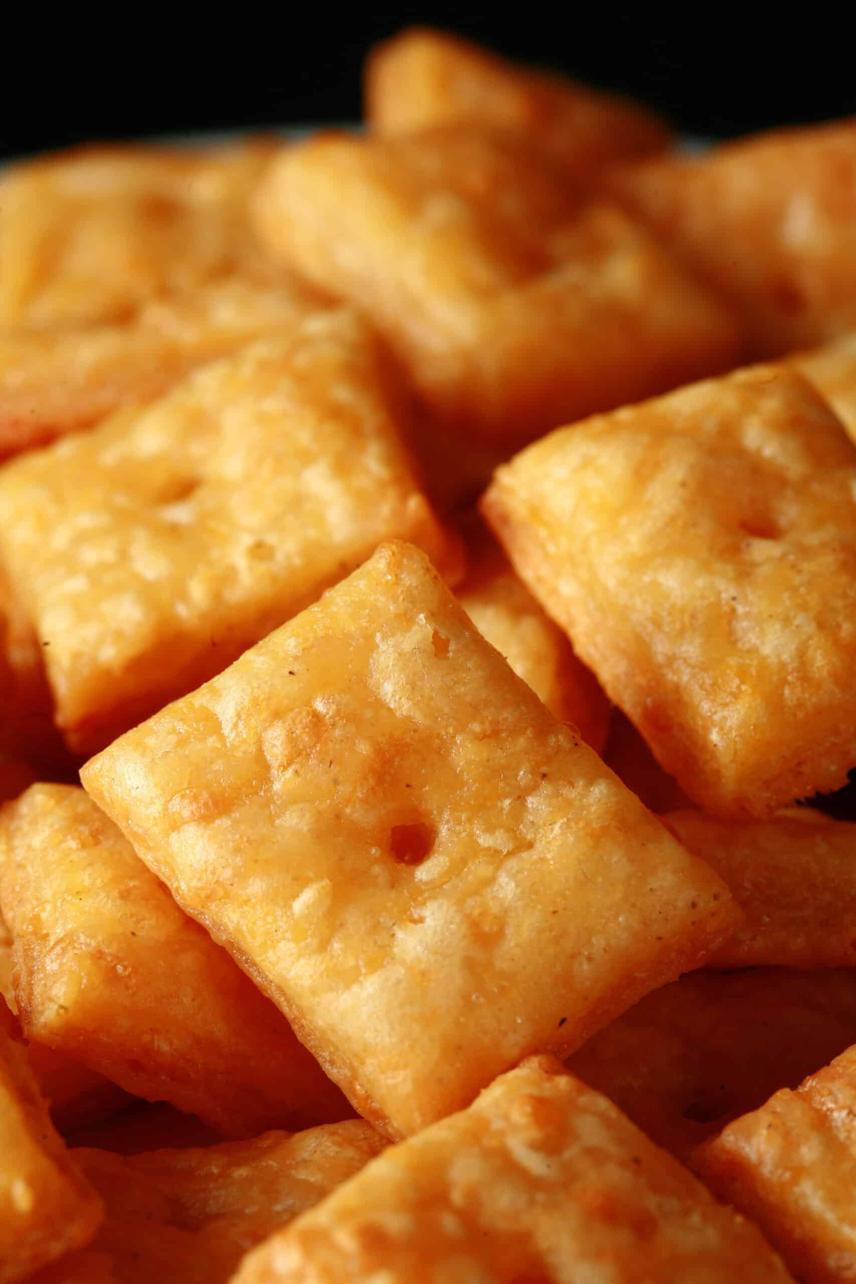 A plate of gluten free cheese crackers - little square gluten free cheez-its!