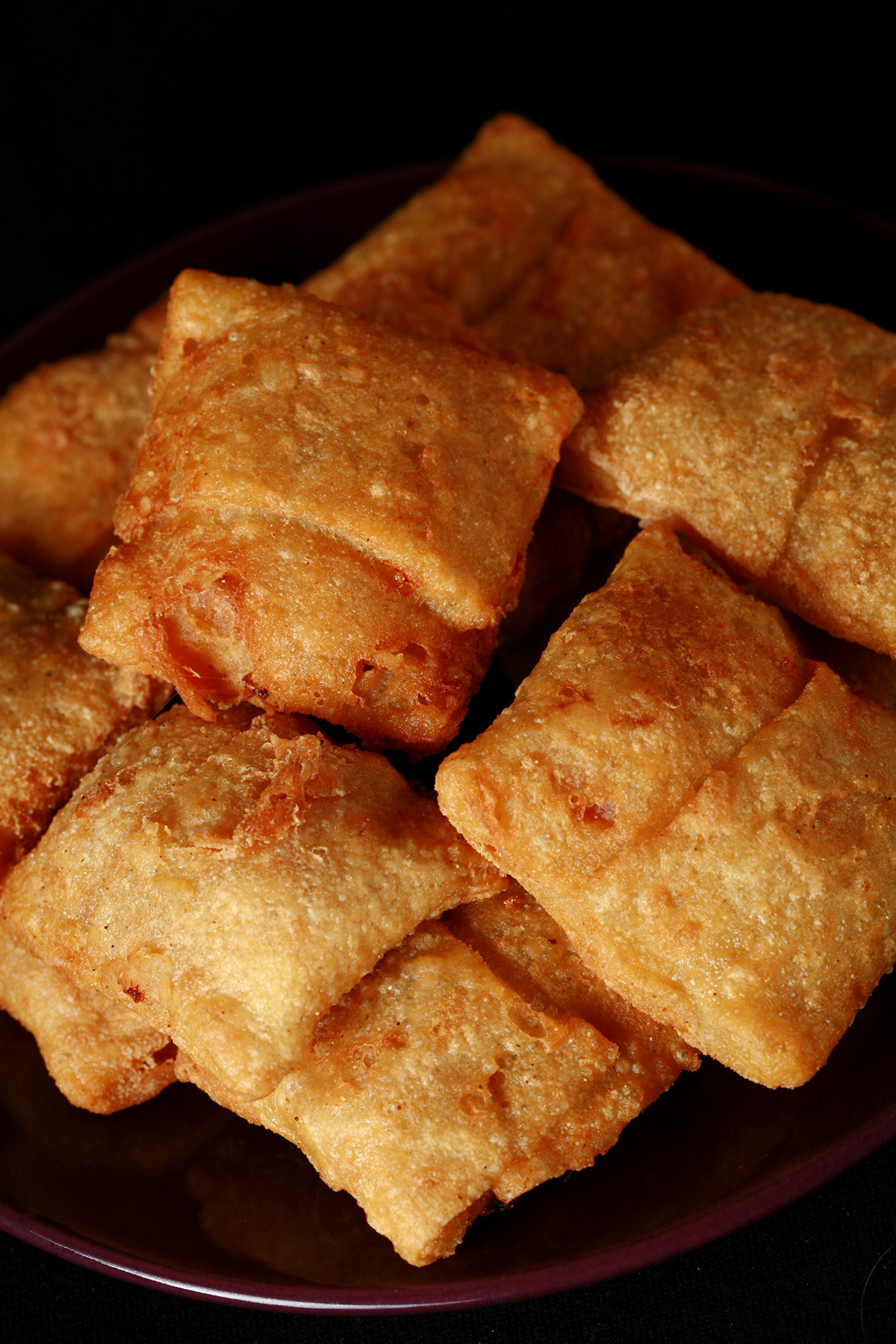 A plate with a pile of gluten-free pizza bites.