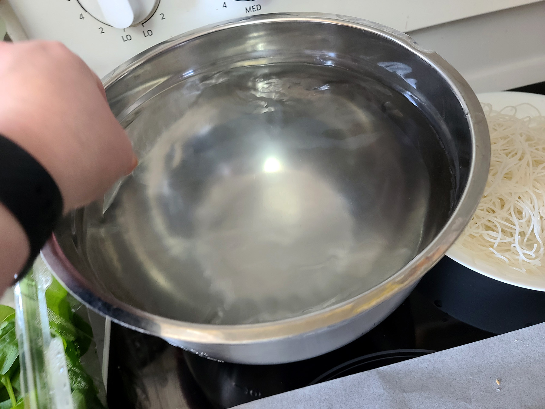 A large metal bowl of hot water.