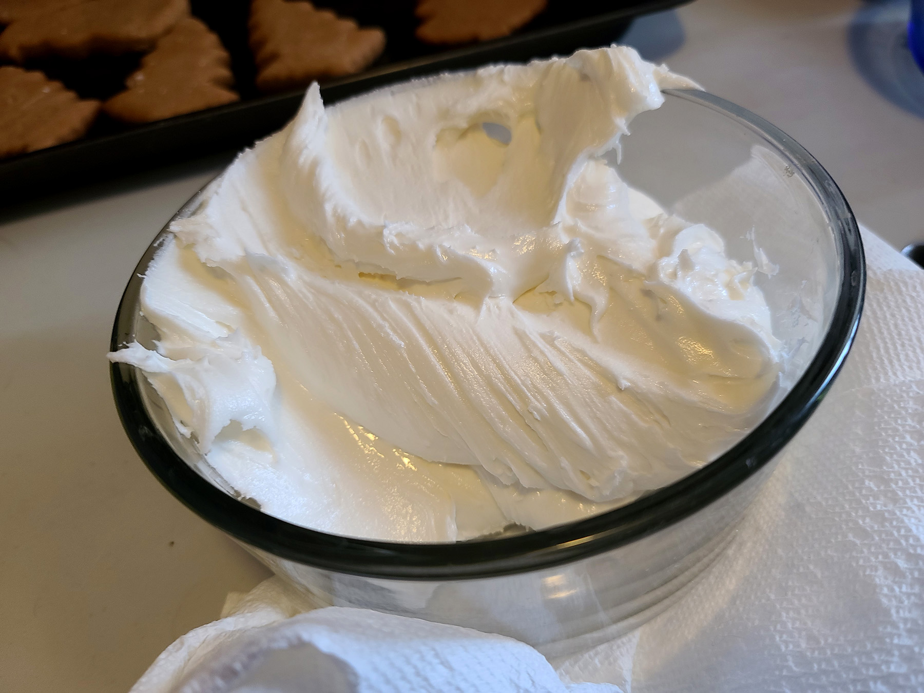 A close up view of a bowl of royal icing.