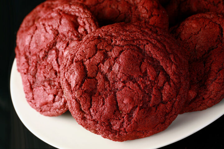 A close up photo of a plate of gluten-free red velvet cookies.