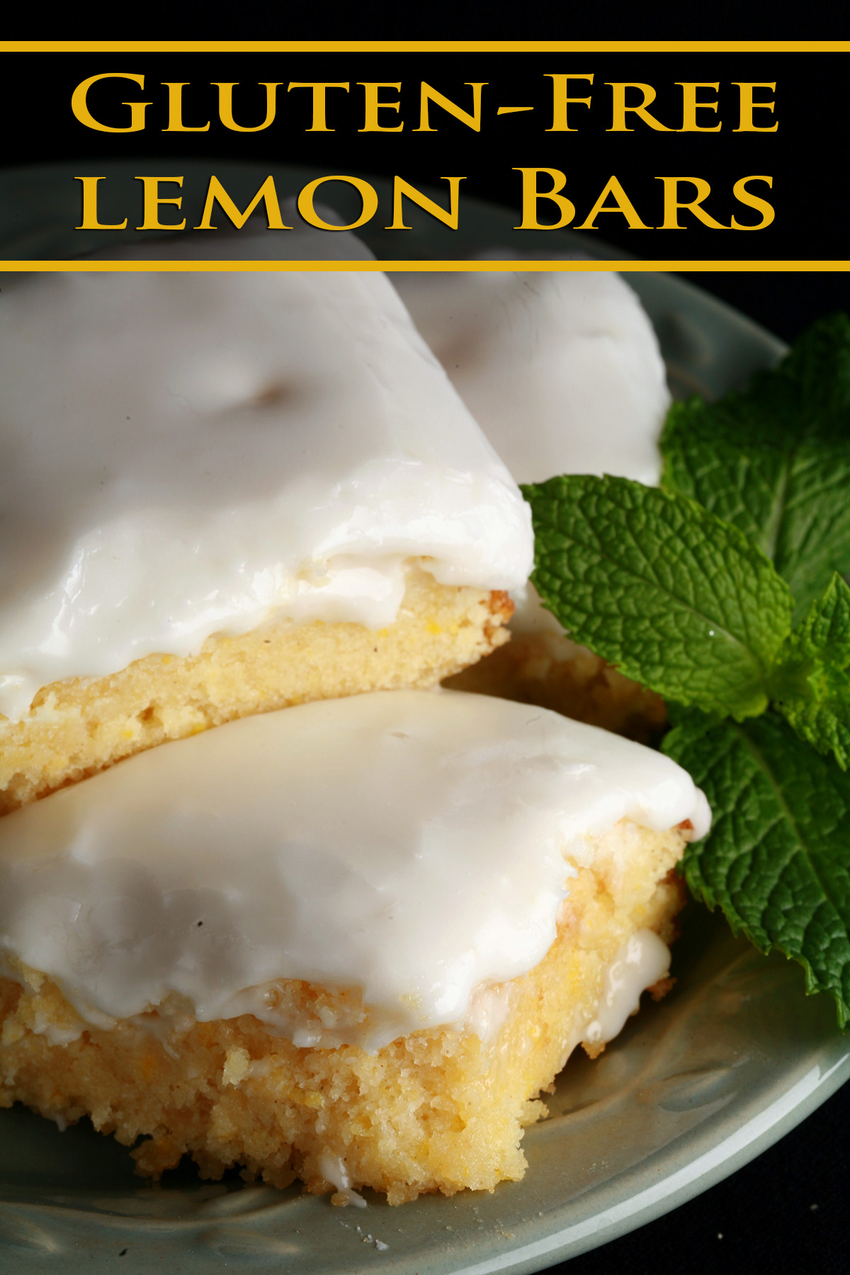 A plate of frosted gluten-free lemon bars, garnished with mint leaves.