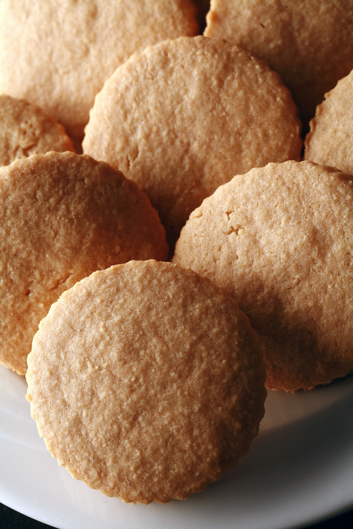 A plate of hexagonal gluten-free shortbread cookies.