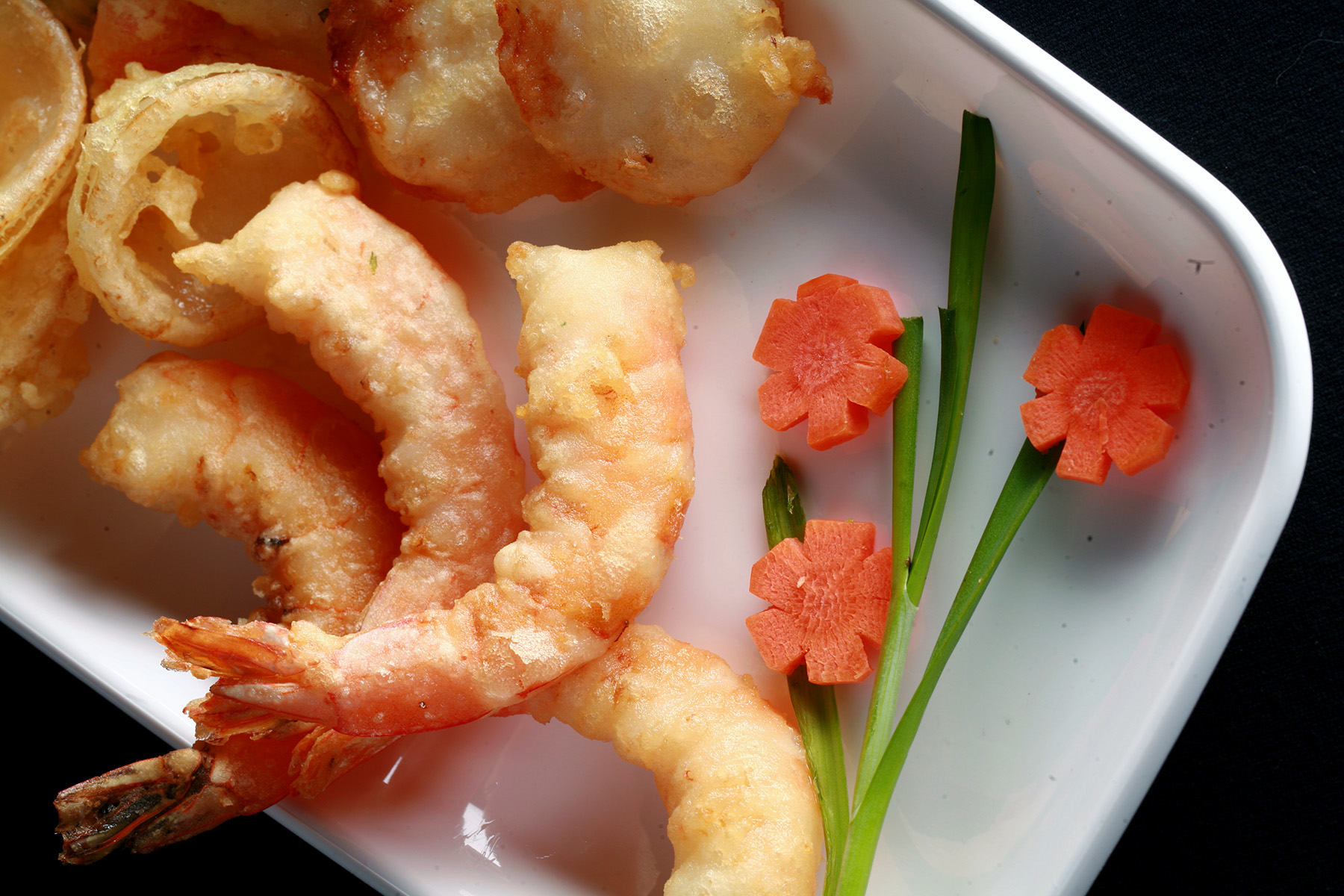A tray of gluten-free tempura shrimp and vegetables.