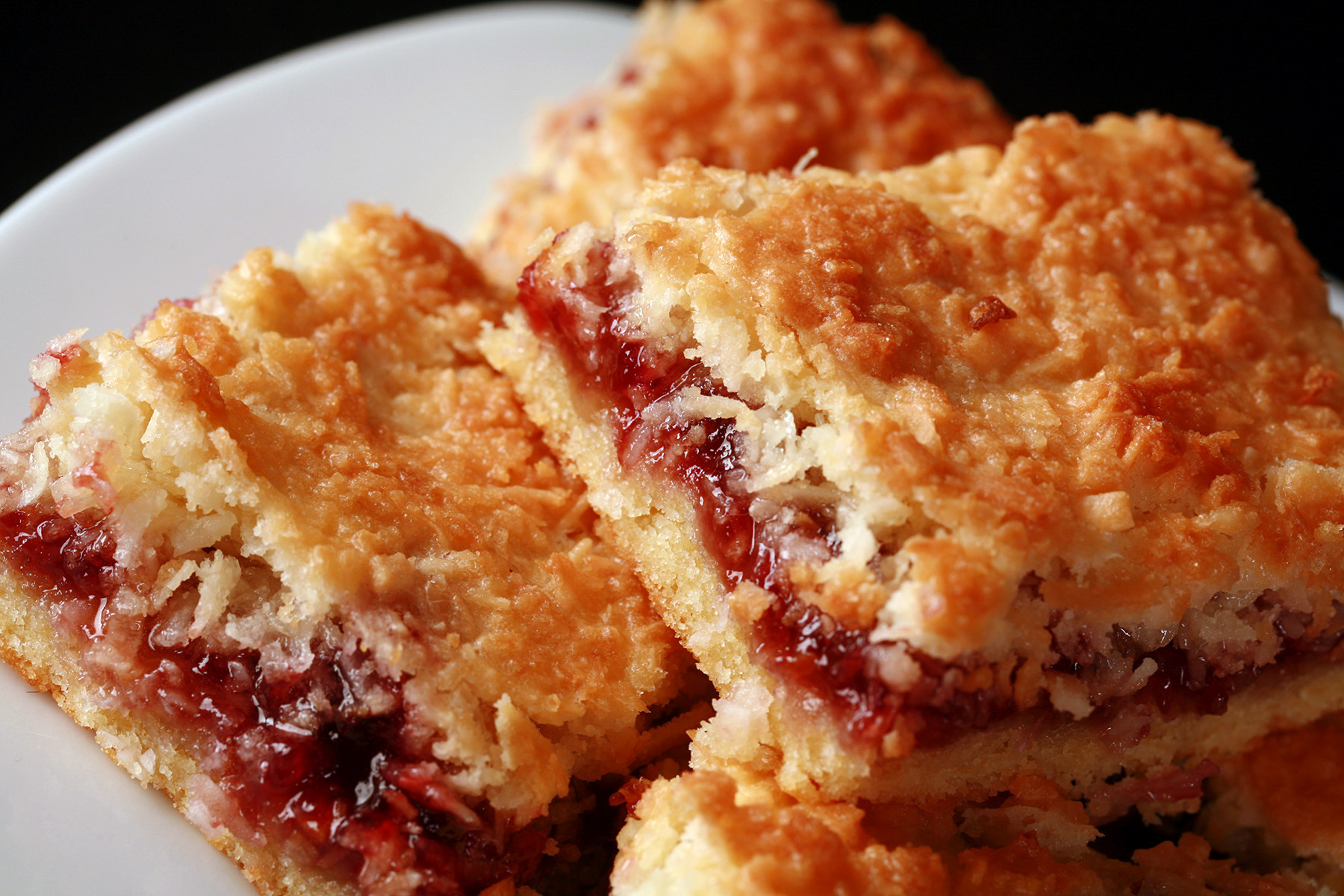 A plate of gluten-free raspberry coconut bars.