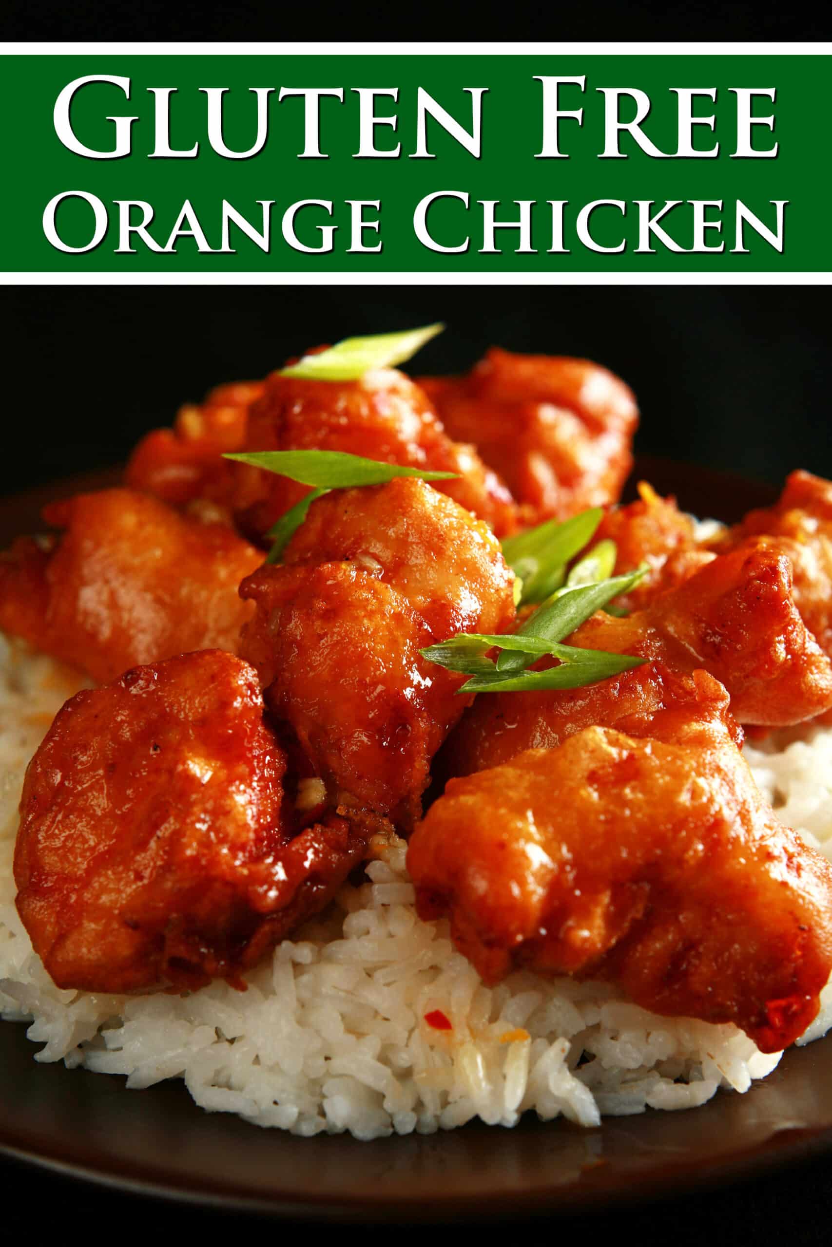 A big helping of gluten-free orange chicken served on rice. Overlaid text says gluten free orange chicken.