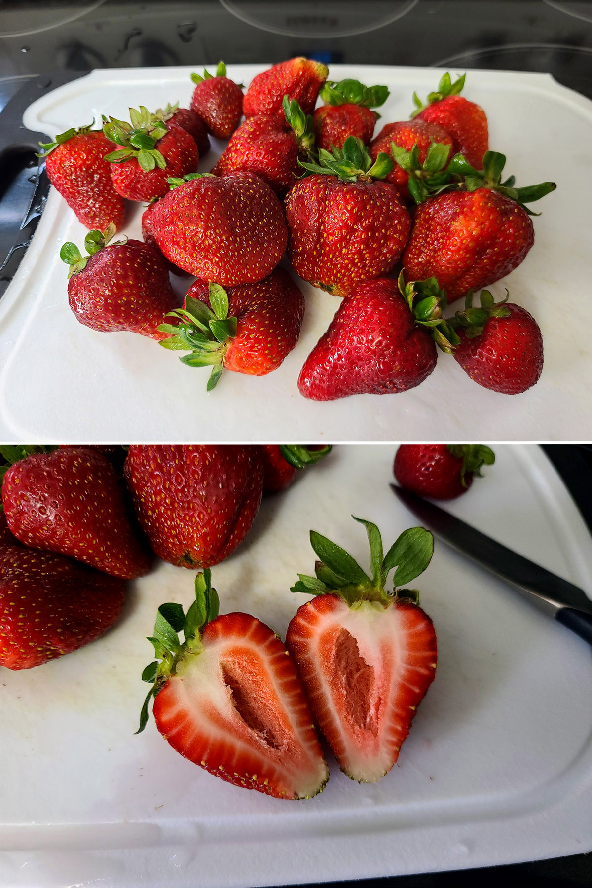 A cutting board with strawberries, one cut in half.