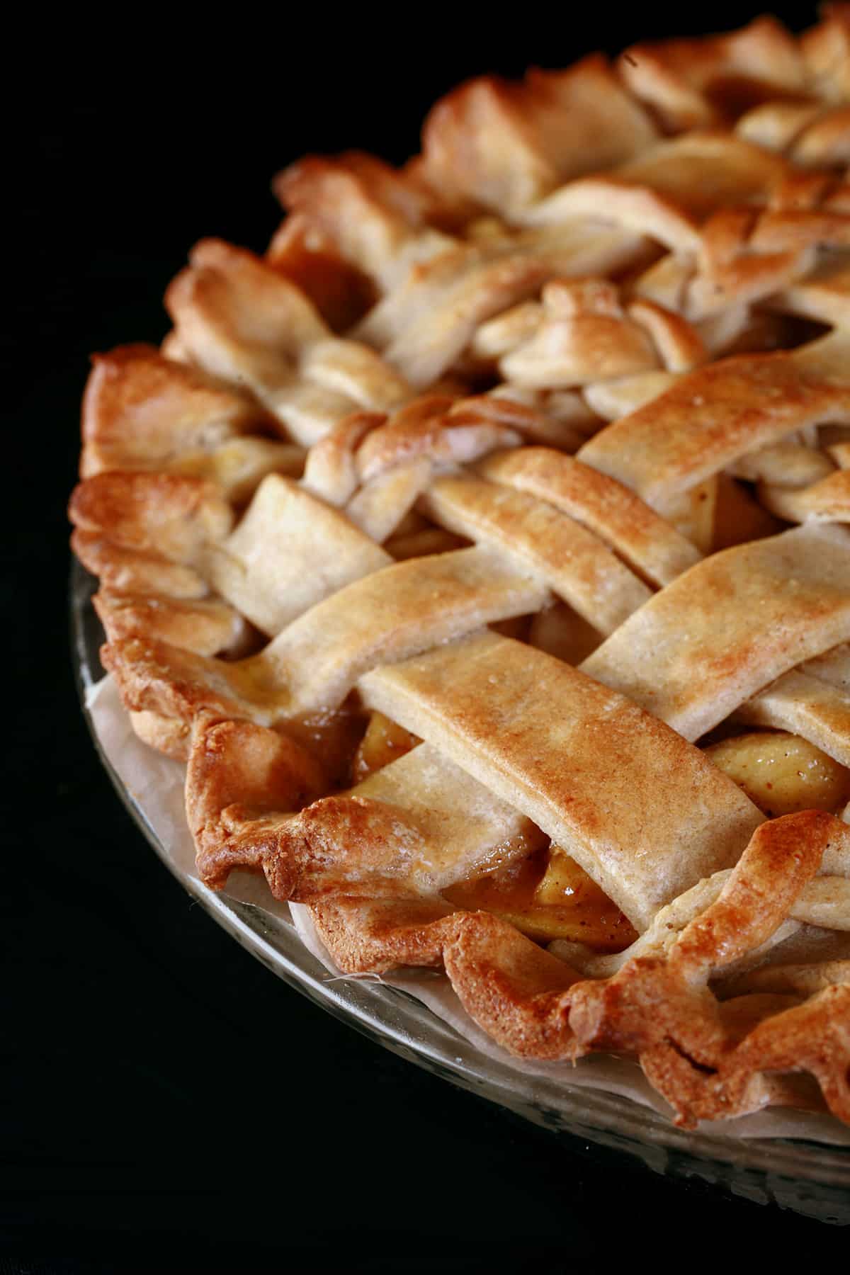 A close up photo of a lattice-top gluten free apple pie.