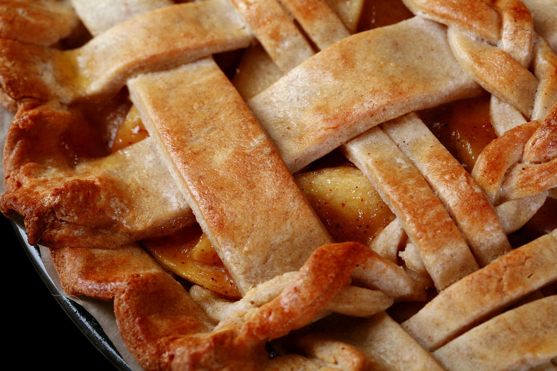 A close up photo of a lattice-top gluten-free apple pie.