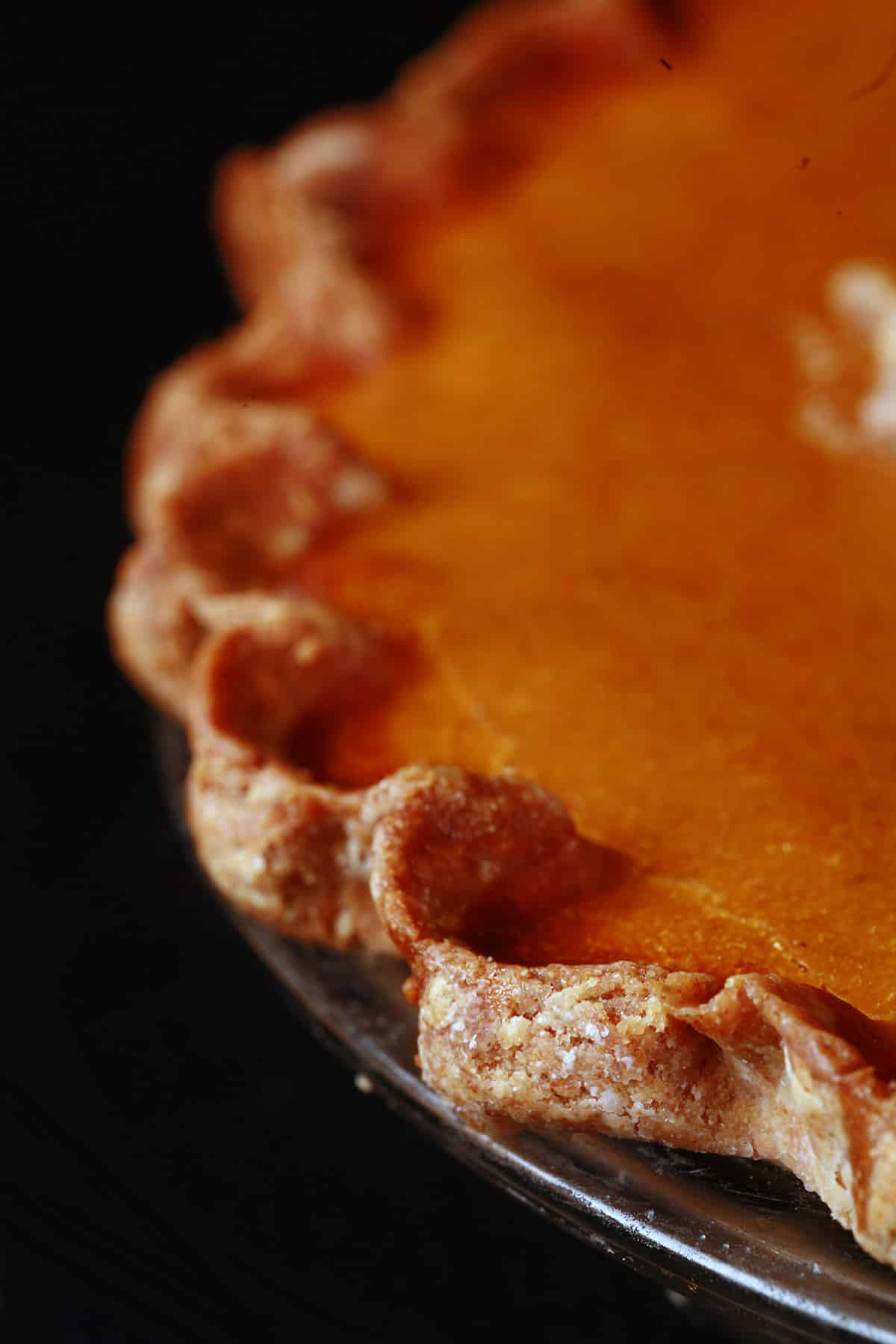 A close up view of a gluten free pumpkin pie crust.