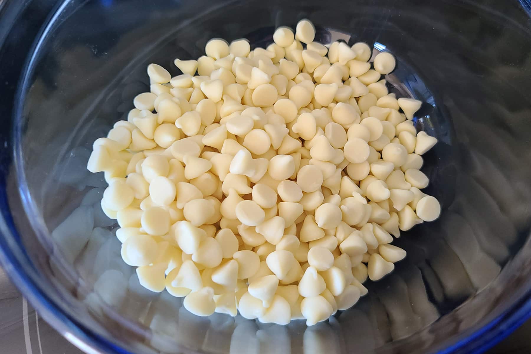 A bowl of white chocolate chips.