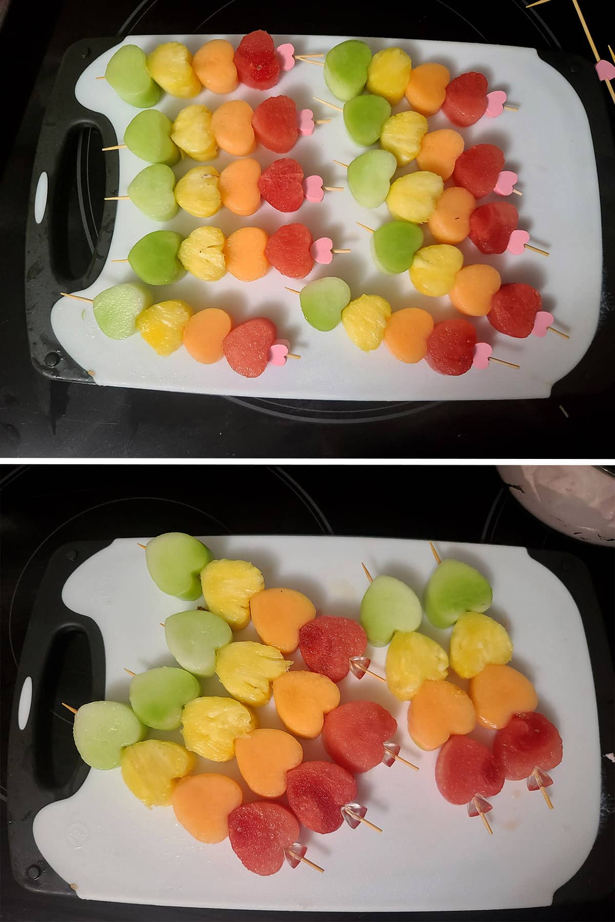 Several rainbow coloured heart shaped fruit skewers on a cutting board.