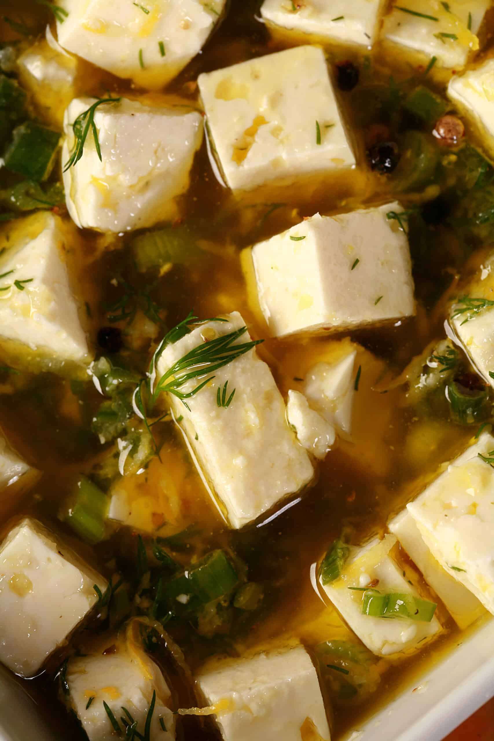 A bowl of lemon herb marinated feta.