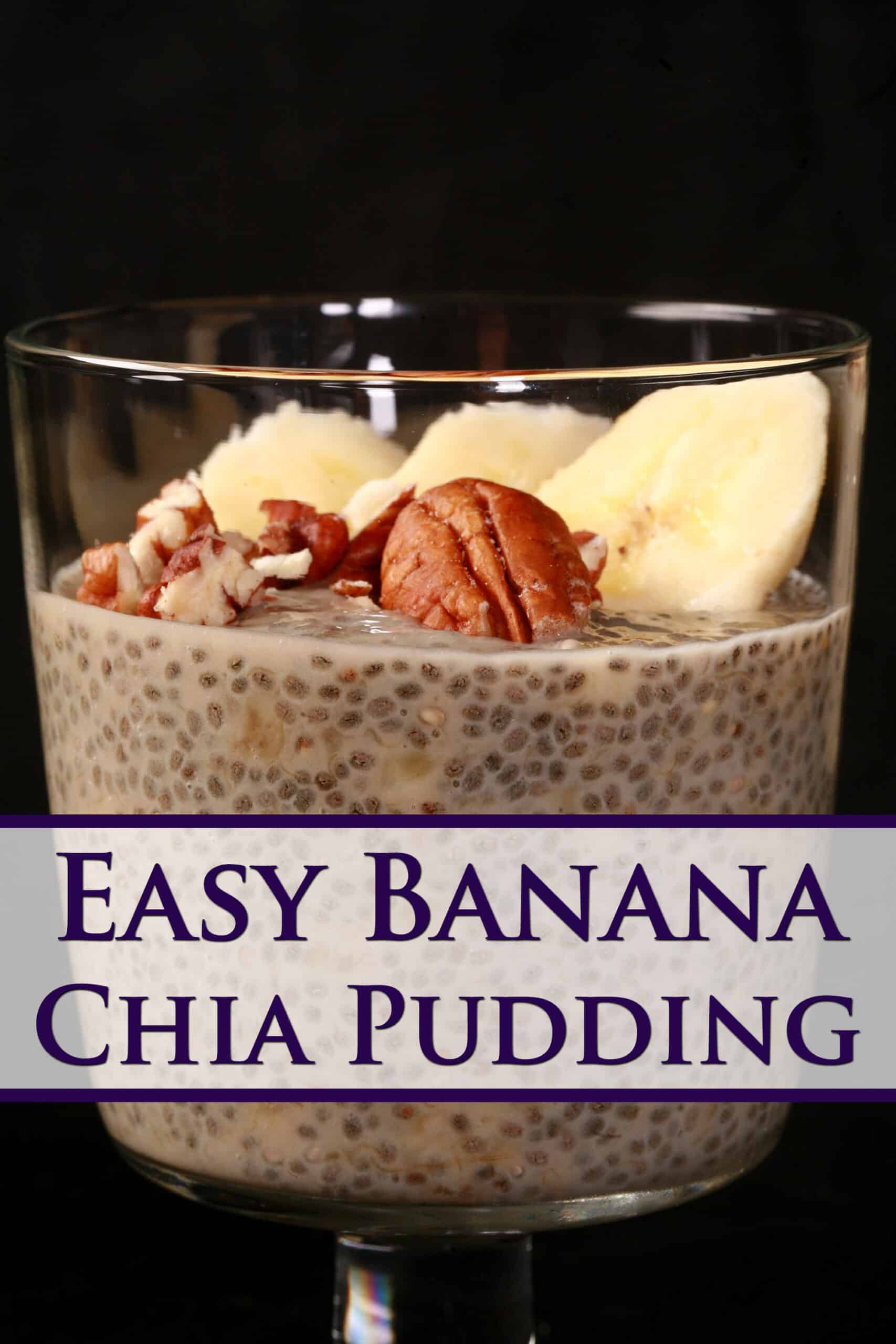 A close up view of a glass of banana chia pudding, topped with banana slices and pecans.