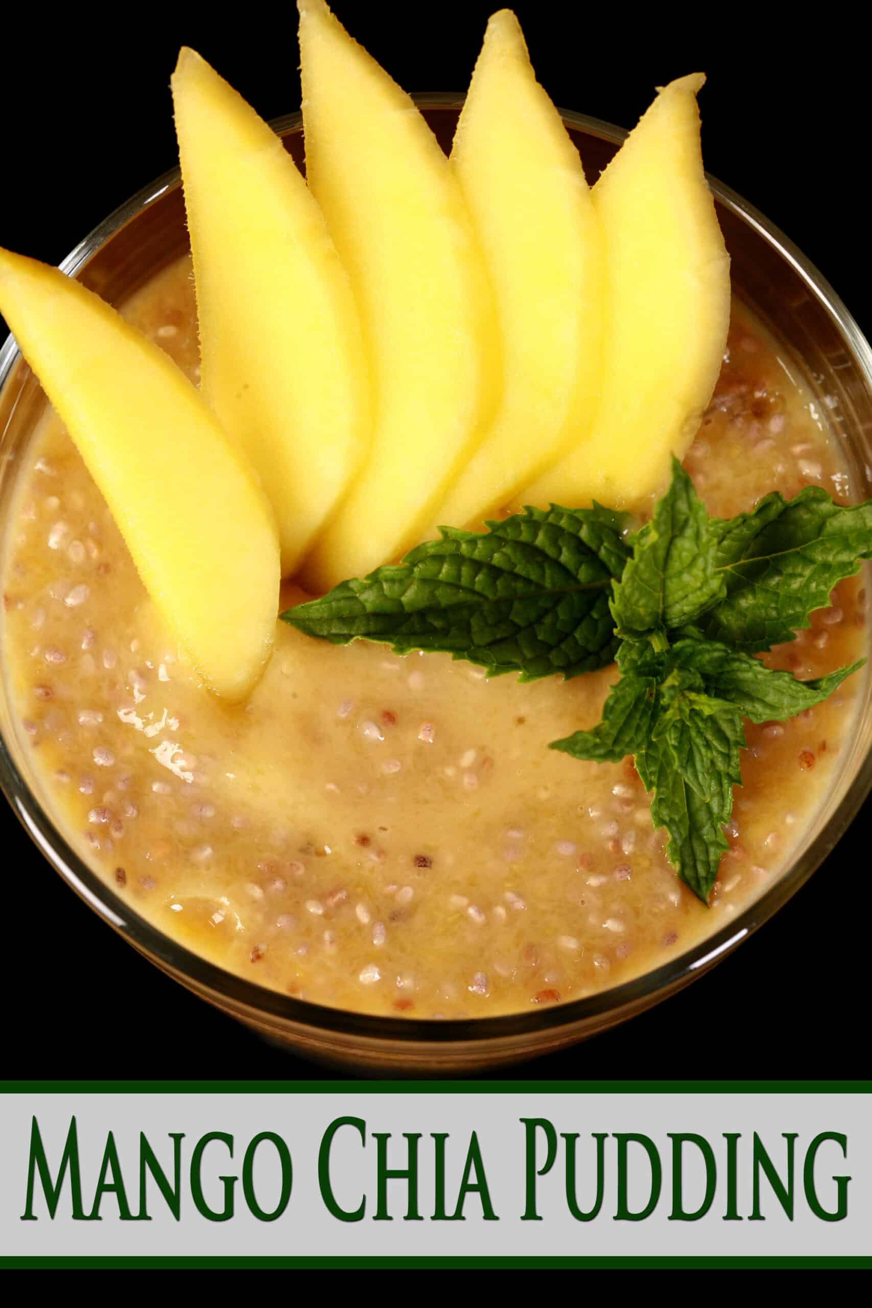 A glass of peach colored chia seed pudding, with sliced mango and fresh mint on top. Overlaid text says mango chia pudding.