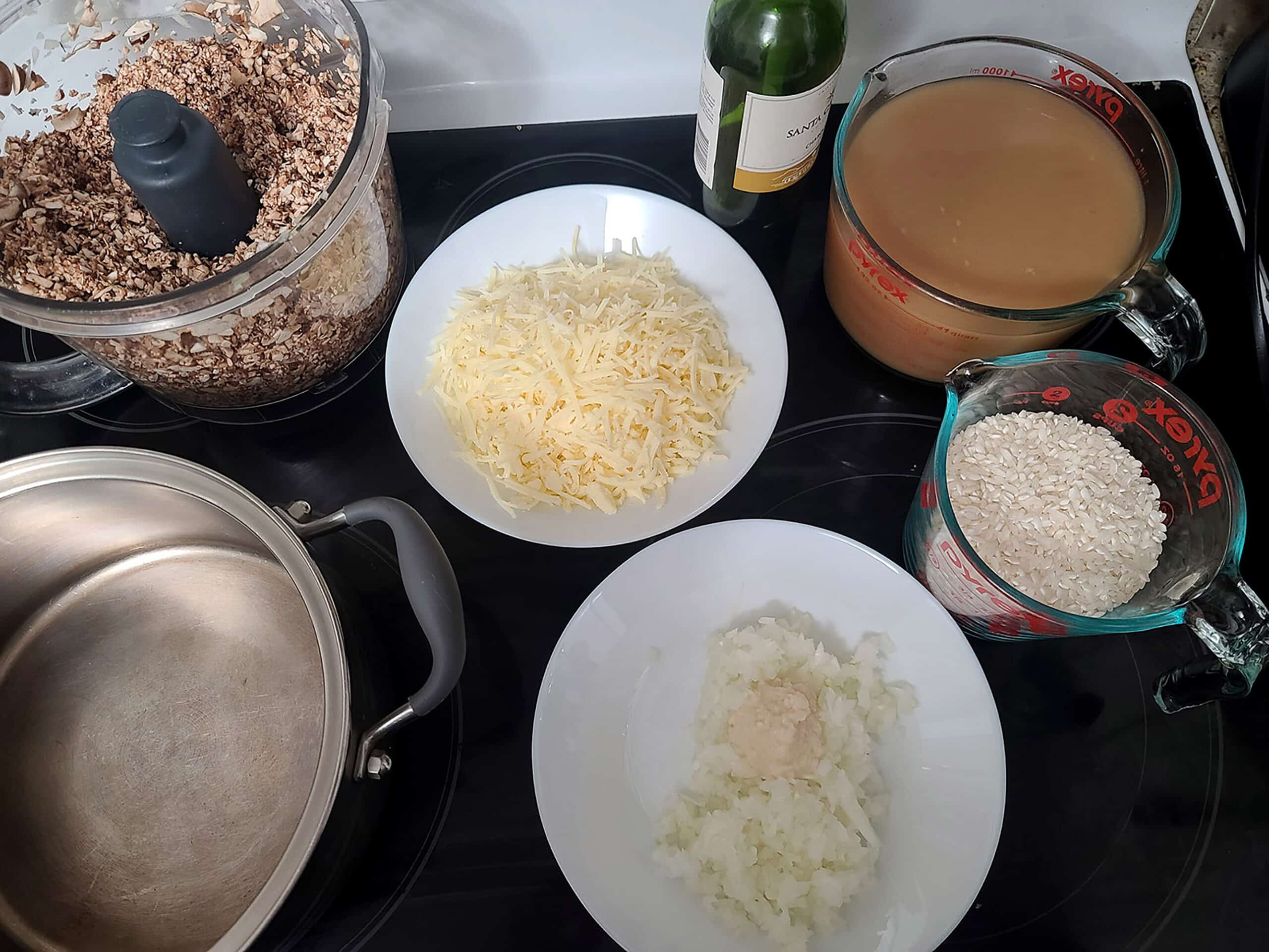 The mushroom risotto ingredients laid out on a stove top.