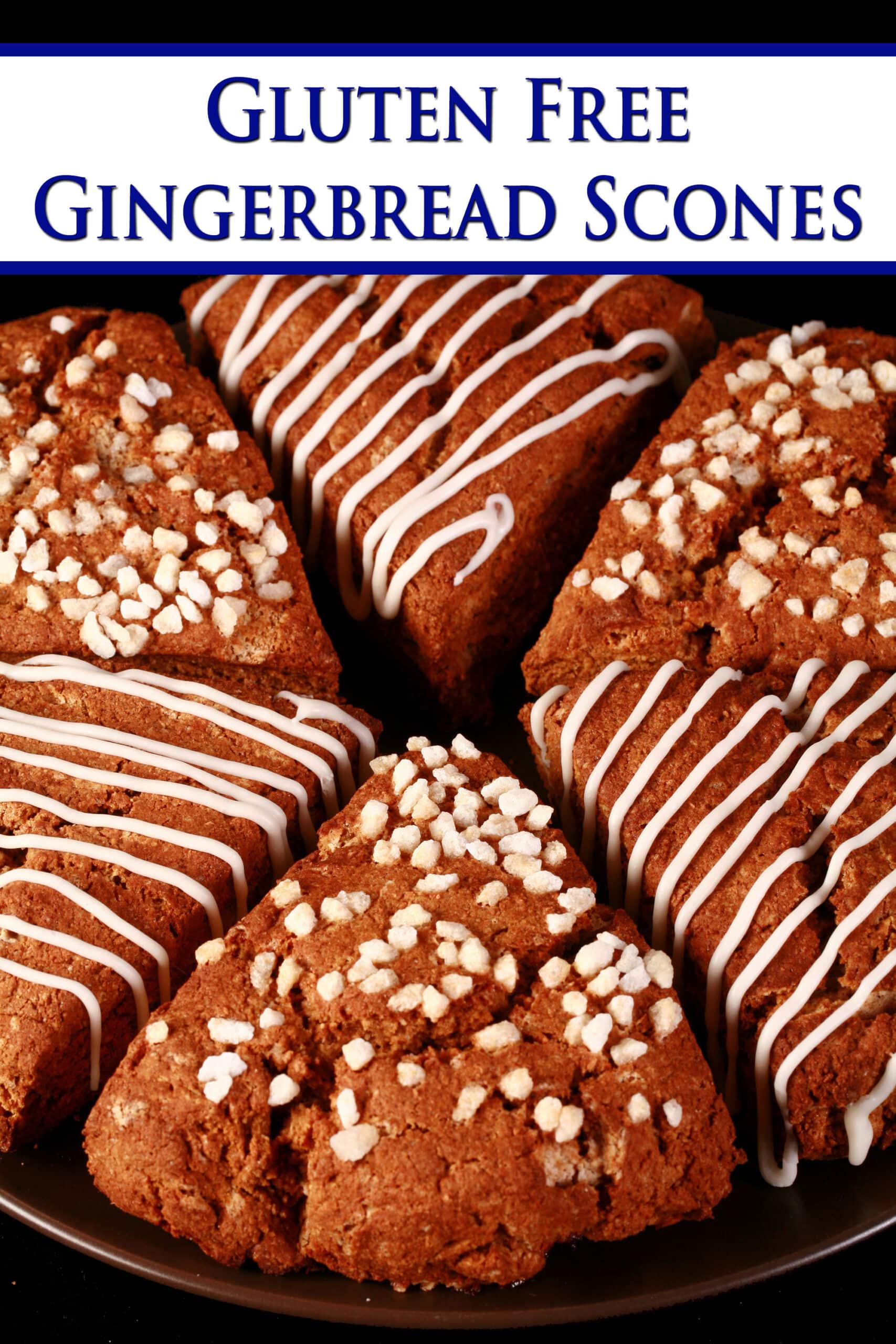 A plate of gluten-free gingerbread scones. Half have a sugar crust, the other half have a vanilla glaze drizzled over them. Overlaid text says gluten free gingerbread scones.