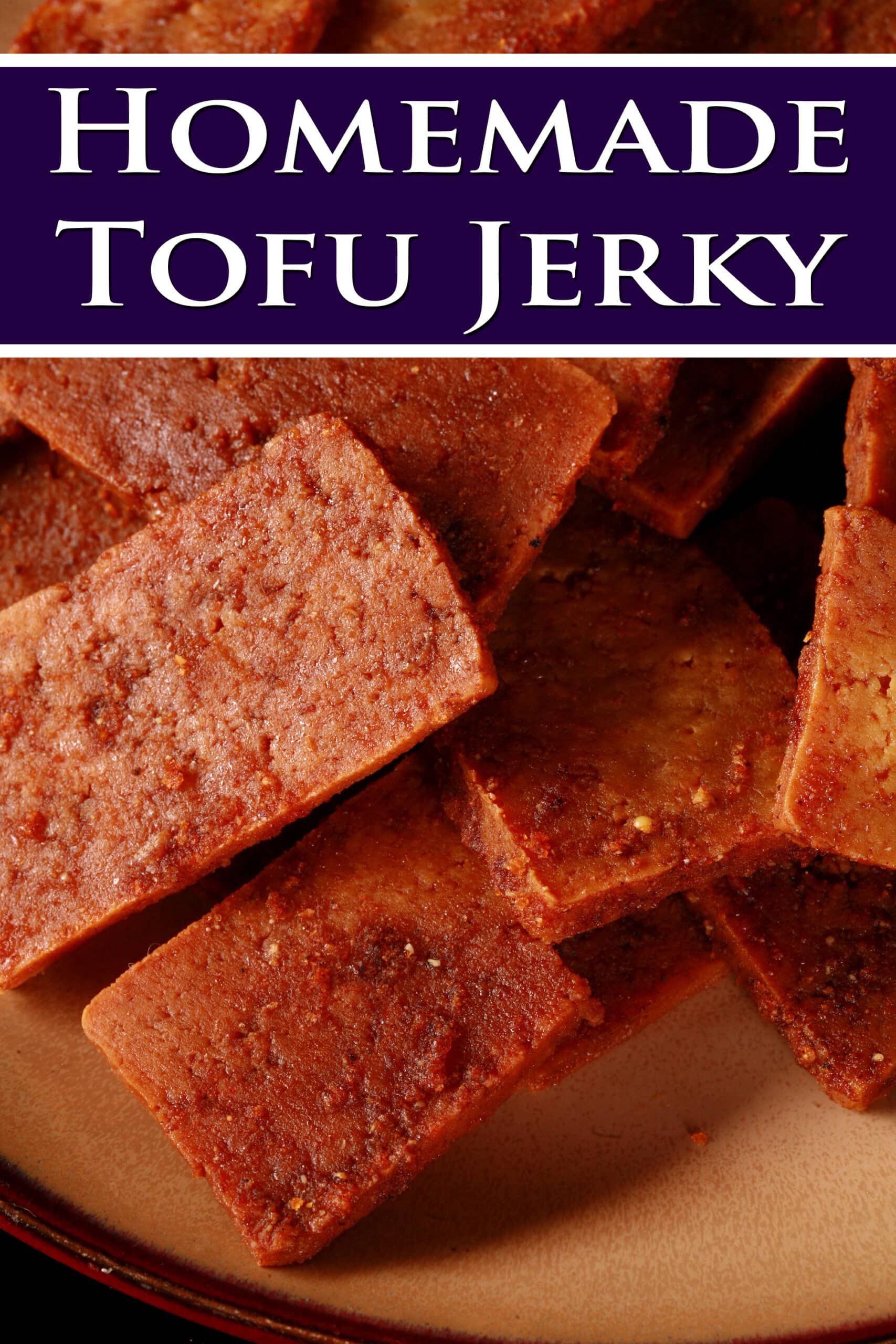 A plate of vegan tofu jerky.  Overlaid text says homemade tofu jerky.