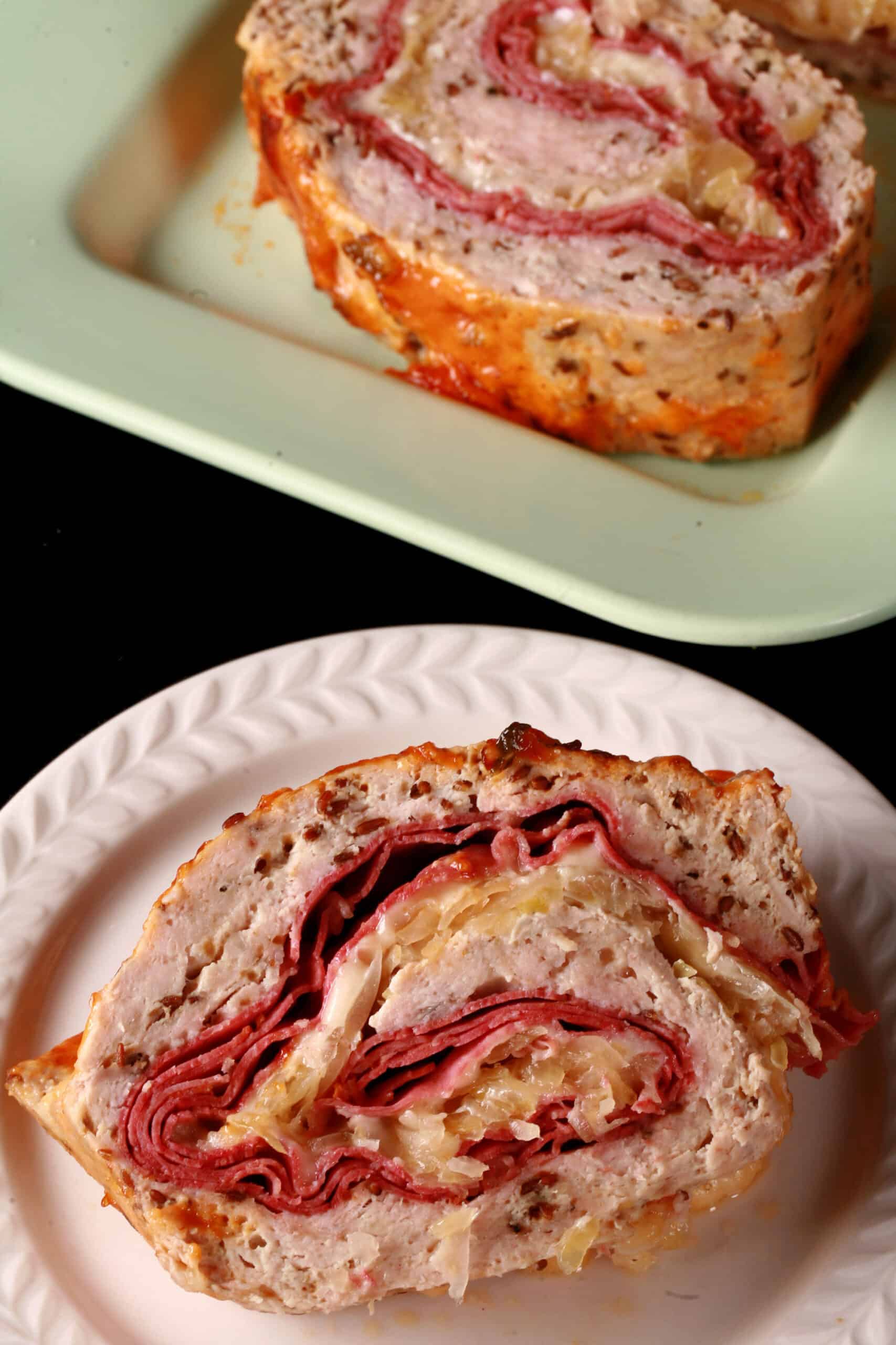 A slice of Reuben Meatloaf on a plate.