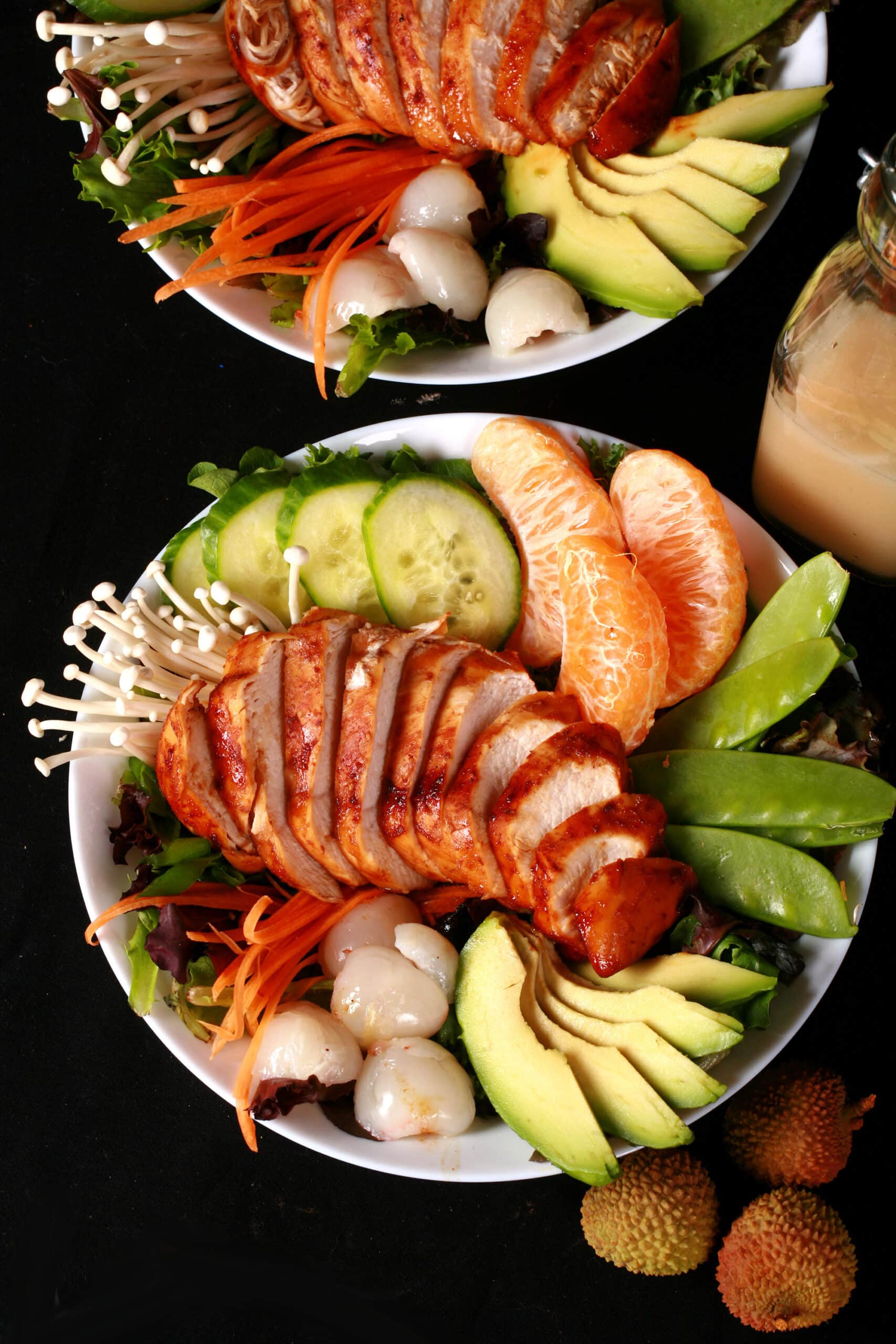 2 Asian chicken salad bowls with lychee vinaigrette.