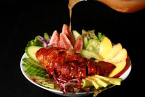 2 summer salads with peaches, figs, avocado, vegetables, and white peach balsamic vinegar glazed chicken breast.