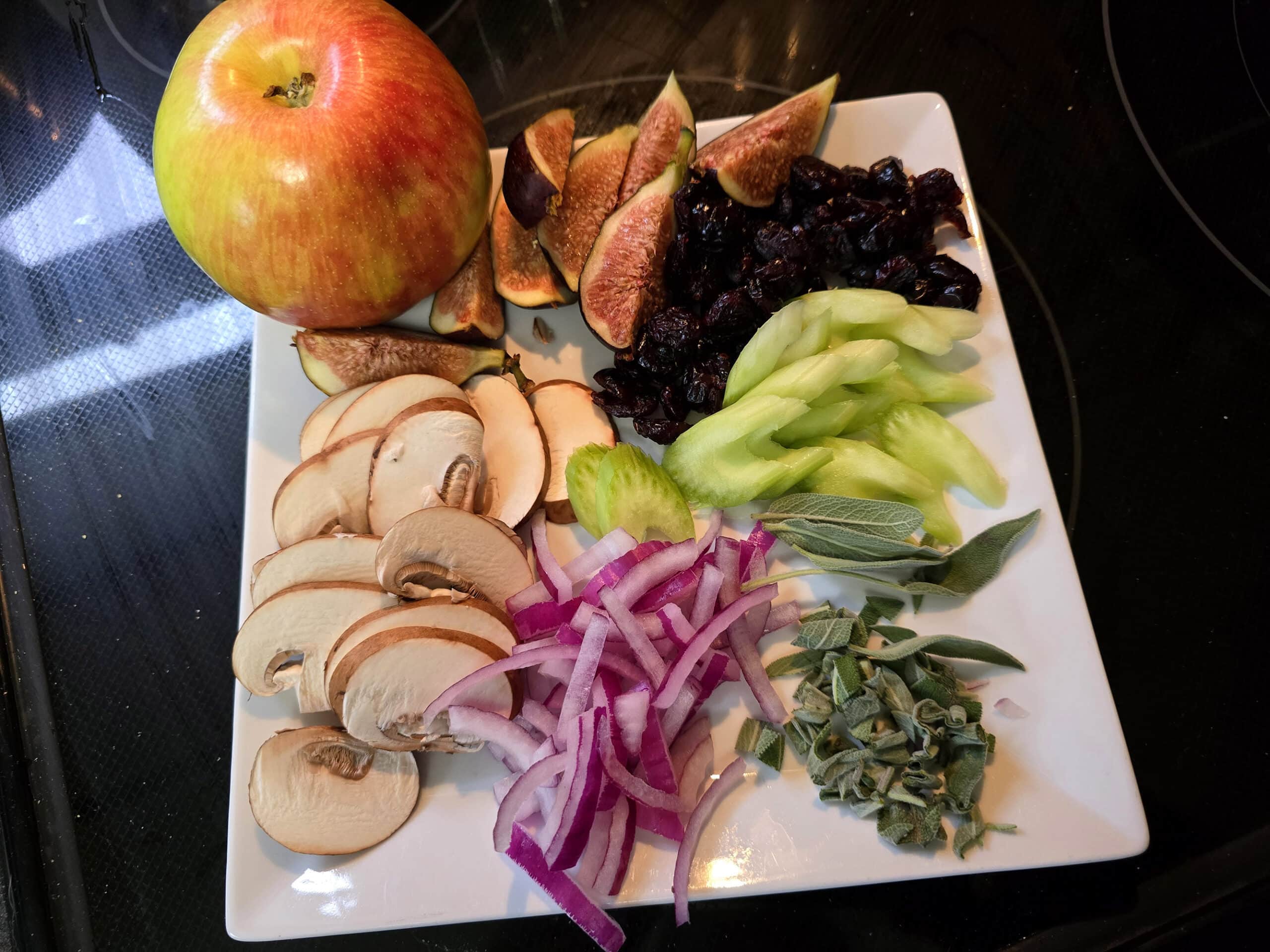 All of the salad toppings prepared and arranged on a plate.