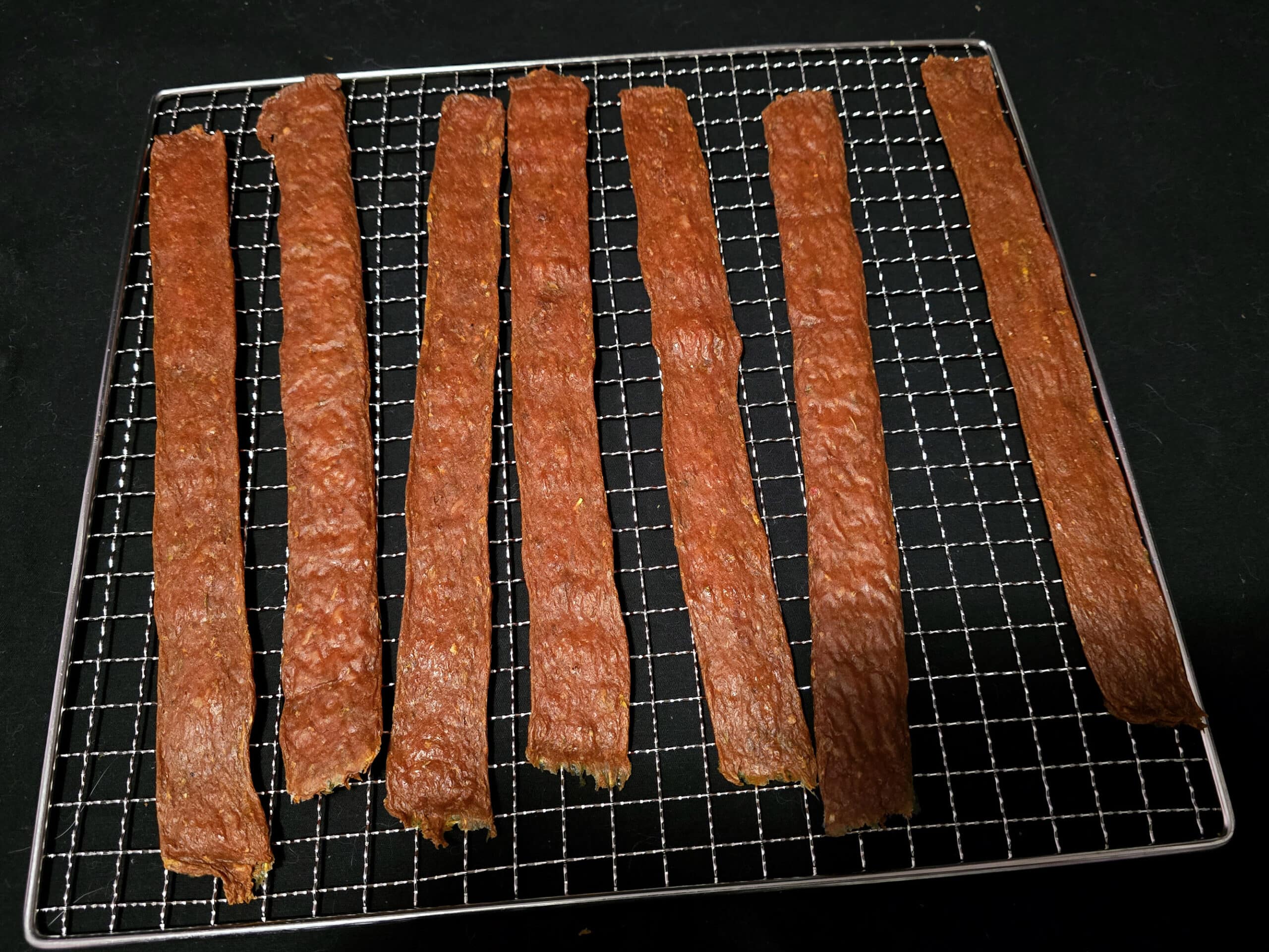 Several strips of shawarma chicken jerky.