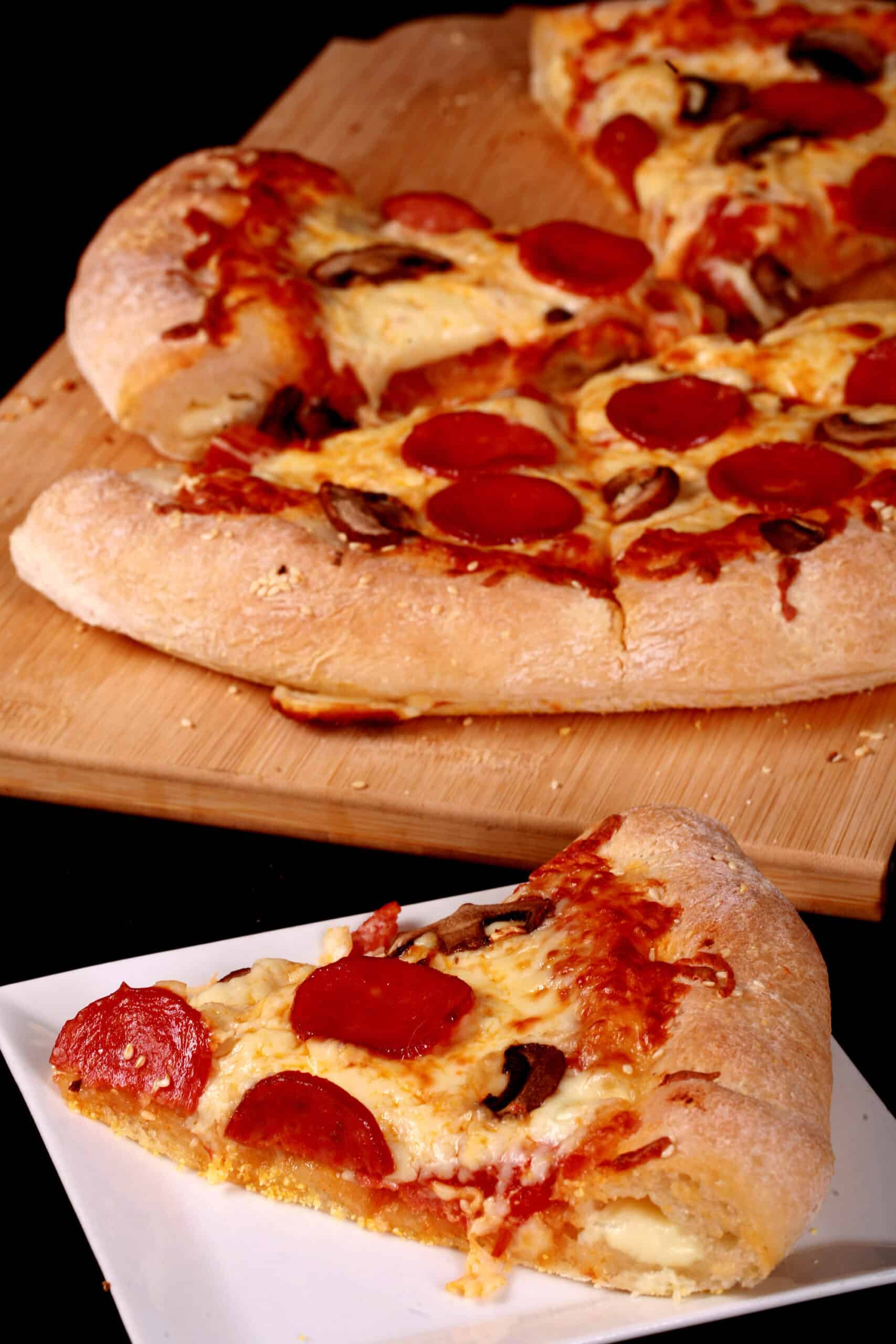 A stuffed crust gluten-free pizza with pepperoni and mushrooms.