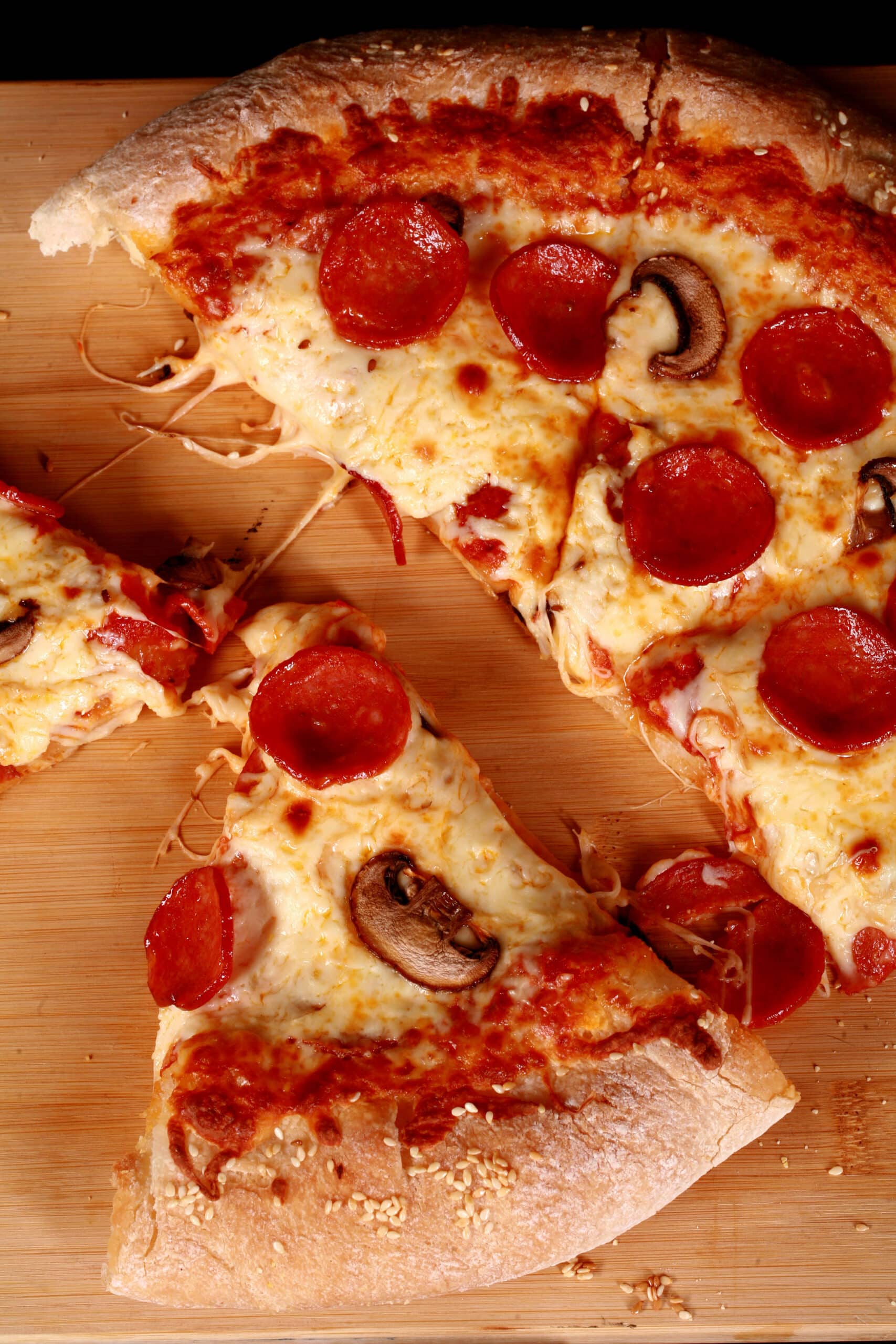 A stuffed crust gluten free pizza with pepperoni and mushrooms.