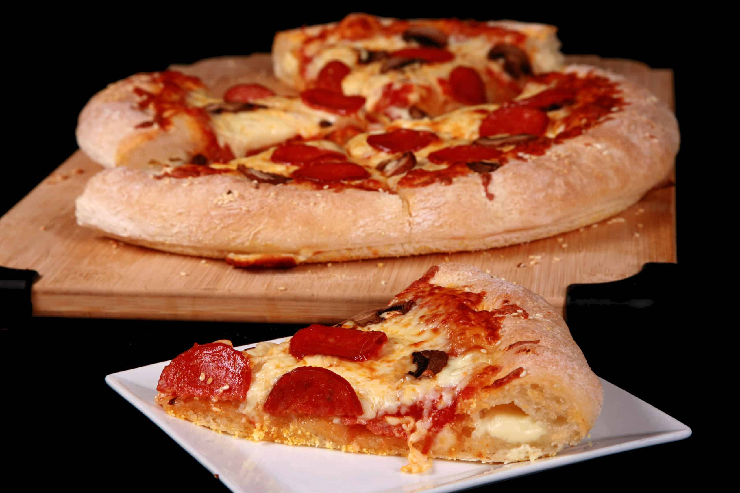 A gluten free stuffed crust pizza with pepperoni and mushrooms.