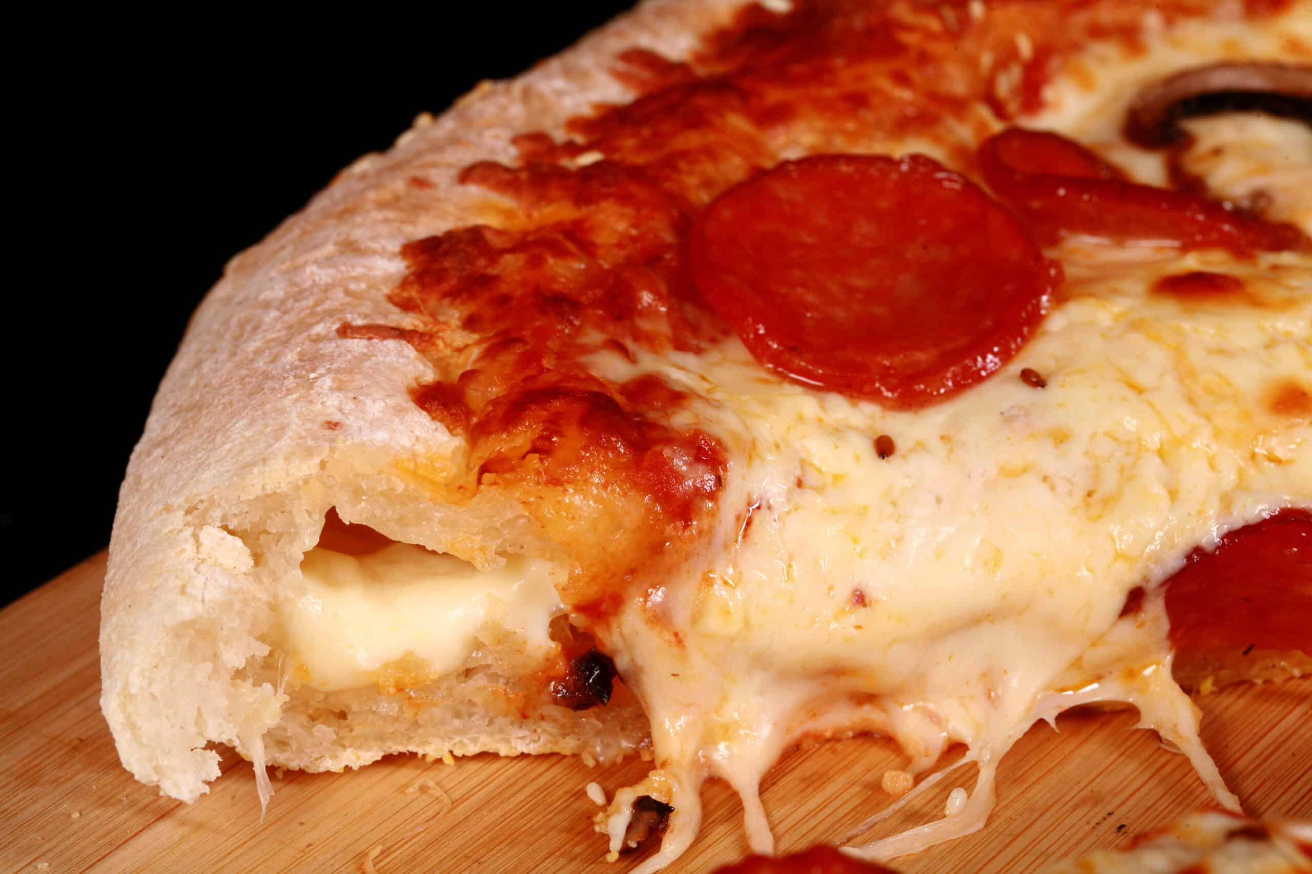 A gluten-free stuffed crust pizza with pepperoni and mushrooms.