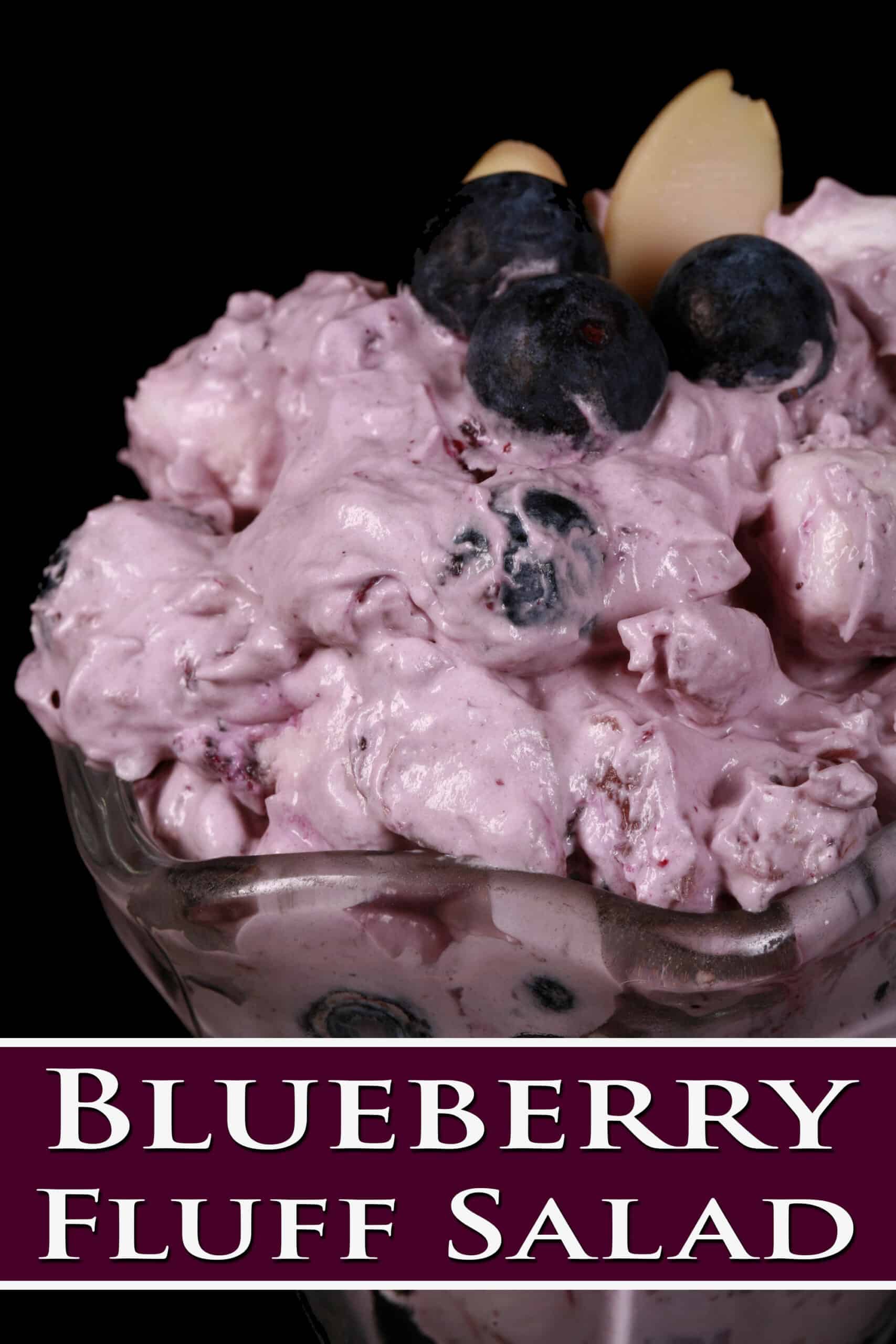 A bowl of blueberry and marshmallow fluff salad.  Overlaid text says blueberry fluff salad.
