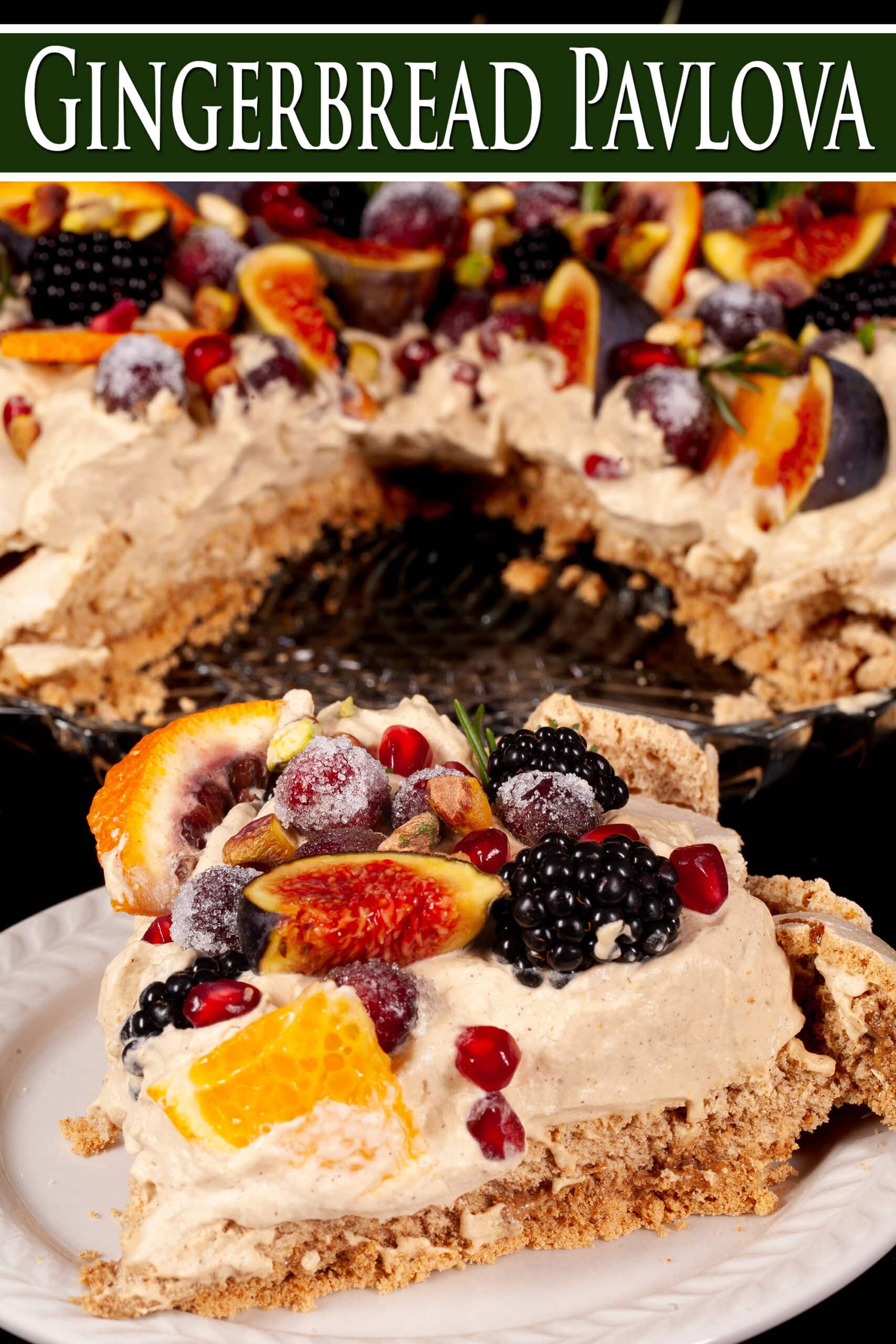 A Christmas pavlova with a gingerbread meringue base, gingerbread flavoured whipped cream, figs, oranges, sugared cranberries, blackberries, pomegranate arils, pistachios, and rosemary.  Overlaid text says gingerbread pavlova.